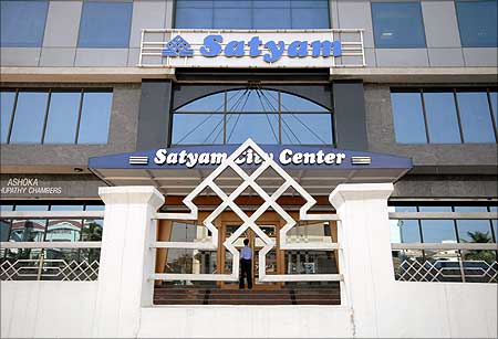 A Satyam employee enters the office building in Hyderabad.