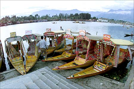 A Kashmiri boatman waits for customers on the banks of Srinagar's famous Dal lake in Kashmir.