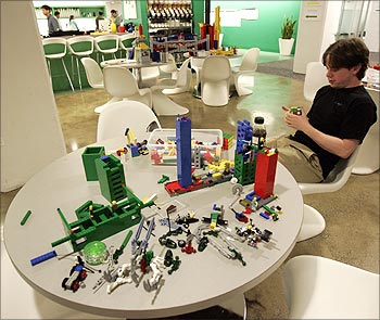 An employee plays with lego at the New York City office of Google.