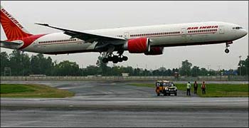 Members of the ground staff watch the inaugural flight of an Air India Boeing 777. Photograph: Vijay Mathur//Reuters