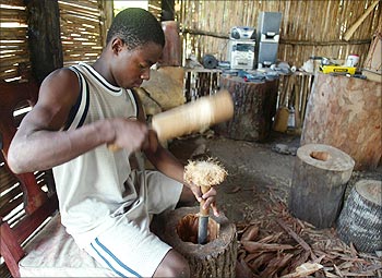 A young man crafts a drum in the community of Sambo Creek on the northern coast of Honduras.