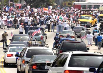 Downtown Los Angeles traffic is halted by immigration rally participants.