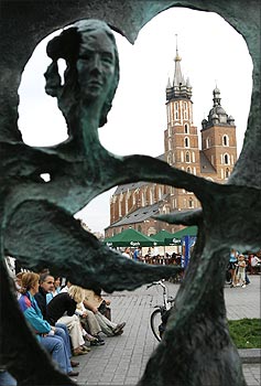 A general view of St. Mary's Basilica is seen through a sculpture in Krakow, southern Poland.