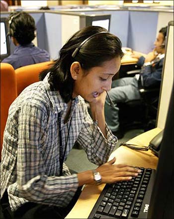 An Indian employee at a call centre provide service support to international customers.