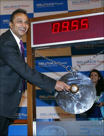 Anil Ambani, chairman of Anil Dhirubai Ambani group, strikes a gong during the listing ceremony of Reliance Power at the BSE in Mumbai on February 11, 2008.
