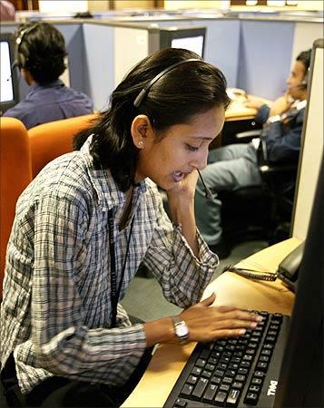 Indian employees at a call centre provide service support to international customers.