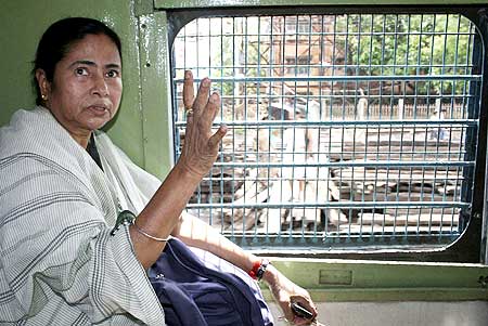 Mamata Banerjee travels in a local train during her visit to a cyclone ...