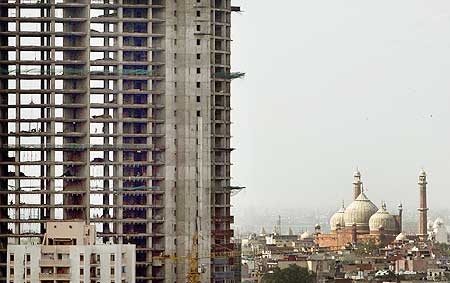 Labourers work at a construction site as the Jama Masjid in New Delhi.