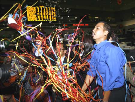 A dealer at the Jakarta Stock Exchange celebrates the end of the final trading session.