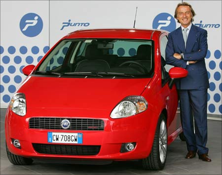Fiat and Ferrari Chairman Luca di Montezemolo poses next to a new Fiat Grande Punto in September 2005.