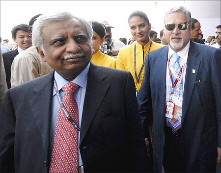Vijay Mallya, Kingfisher Airlines chairman (R) and Naresh Goyal, Jet Airways chairman.