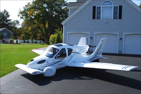 The Transition Roadable Light Sport Aircraft Proof of Concept with wings extended at home.