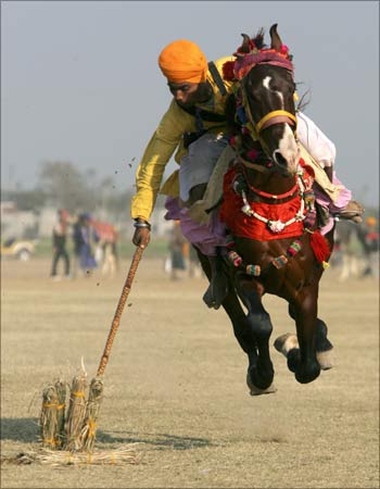 An Indian villager takes part in the Kila Raipur sports festival in Ludhiana.