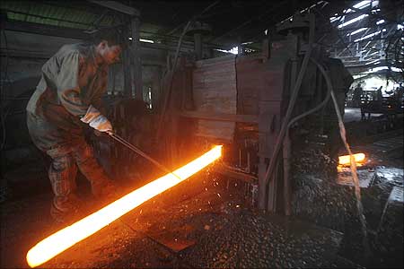 A labourer works at a mild steel factory in Siliguri.