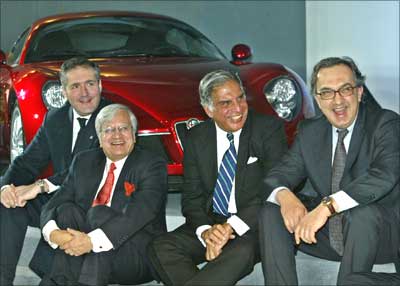 Sergio Marchionne (R), Fiat chief executive, Ratan Tata (2nd R), chairman of TATA group of companies, Ravi Kant (2nd L), managing director of Tata Motors and Alfredo Altavilla, CEO of Tofas, smile after unveiling a Fiat car at the 8th Auto Expo in New Delhi on January 13, 2006. | Photograph:  Kamal Kishore/Reuters