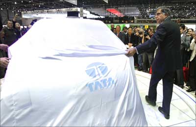 Tata Motors' chairman Ratan Tata unveils the Nano during the first media day of the 78th Geneva Car Show at the Palexpo in Geneva. | Photograph: Denis Balibouse/Reuters