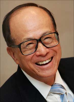 Hutchison Whampoa chairman Li Ka-shing smiles at a news conference in Hong Kong. | Photograph: Bobby Yip/Reuters