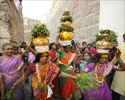 Devotees take part in the annual religious festival, Bonalu, in Hyderabad