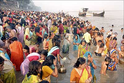 Devotees take a dip in the holy Ganges during the Chhat Puja celebrations in Patna