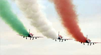Indian Air Force 'Suryakiran' jet trainers perform during an air show