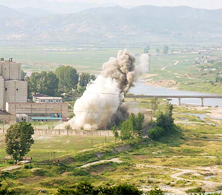 A cooling tower is demolished at a North Korean nuclear plant.