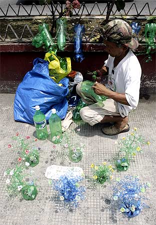 Decorative vases made from plastic soft drink bottles.