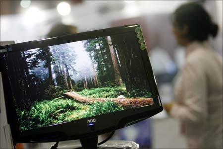 A computer screen is displayed at a stall at the 'COM-IT Infotech Expo.