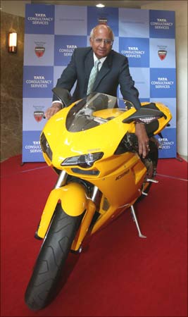 S Ramadorai, CEO of Tata Consultancy Services, poses with a Ducati motorcycle. TCS has signed a multi-million dollar, multi-year deal with Ducati Motor Holding.