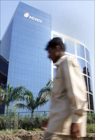 A man walks past the ICICI Bank headquarters in Mumbai.
