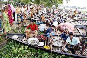 Fishermen sell their catch near Dhaka.