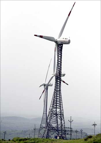 Power-generating windmill turbines are seen in Suzlon wind farm at Sanodar village near Ahmedabad.