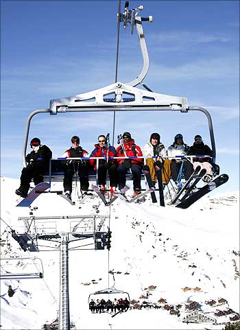 Skiers on a chairlift at Les Crosets, 120 kilometres  east of Geneva.