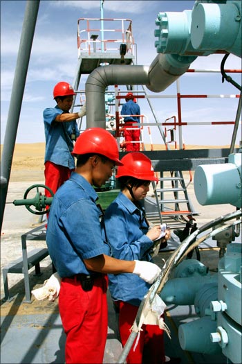 Chinese employees of China National Petroleum Corp. work at Tarim Oil Field.