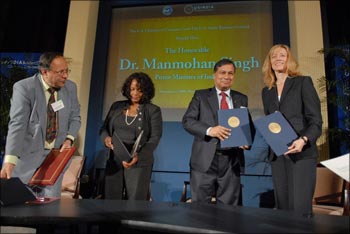 Ajay Shankar (Ambassador Meera Shankar's husband) and Samir Brahmachari signing an Mou with US representative at the USIBC event.