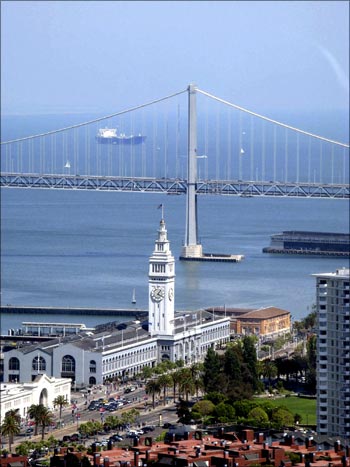 The Embarcadero district of San Francisco looking toward the Oakland Bay Bridge is seen from the Coit Tower.
