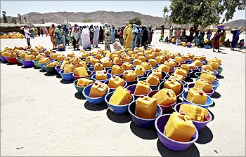 Buckets await distribution to people displaced by war near the town of Gos Beida in eastern Chad.