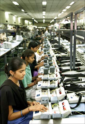 Indian workers inside a factory in Bangalore.