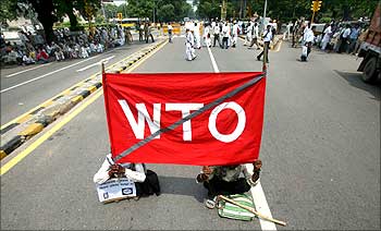 Activists of the Indian Peoples Campaign Against WTO hold a banner during a protest against the World Trade Organisation in Delhi.