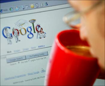 An internet surfer views the Google home page at a cafe in London.