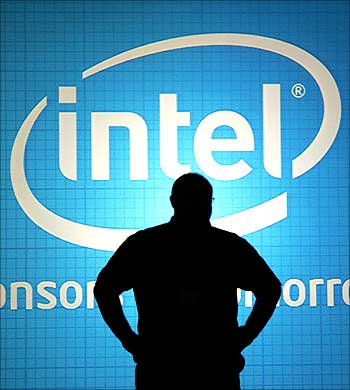 A man stands in front of an Intel wall at the 2009 Computex trade show in Taipei.