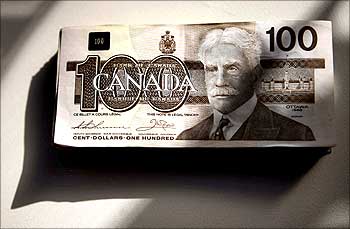Canadian one hundred dollar bills are displayed in Toronto.