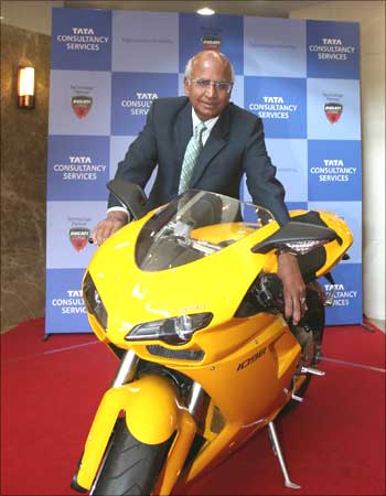 Former TCS chief S Ramadorai poses with a Ducati motorcycle.