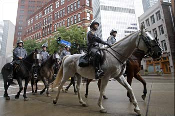 Police on horseback patrol the streets in advance of the G20 Pittsburgh Summit.