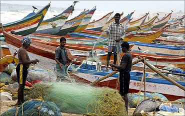 Fisherfolk's boats at a beach in Chennai.