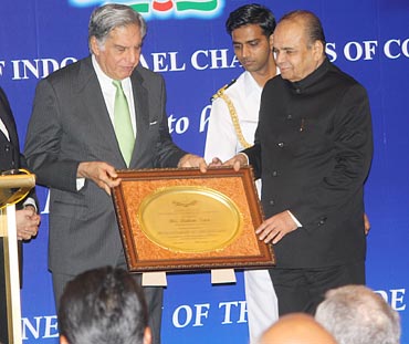 Tata Sons chairman Ratan Tata being given the Buisnessman of the Decade award by Maharashtra Governor K Sankarnarayanan.