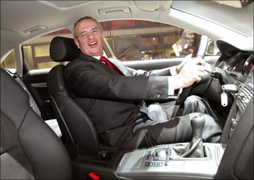 A man looks at a new Audi A6 during the company's annual shareholder meeting in Ingolstadt.