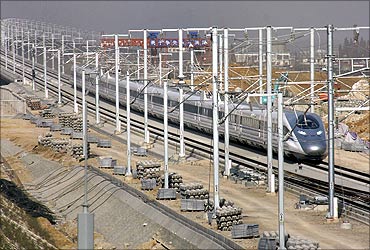 A high speed train travels during a test operation in Bengbu, Anhui province on December 3, 2010.