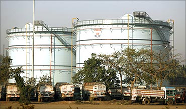 Oil tankers are stationed at a storage station of a petroleum company in Mumbai.