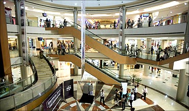 People stroll in Inorbit mall in Mumbai.