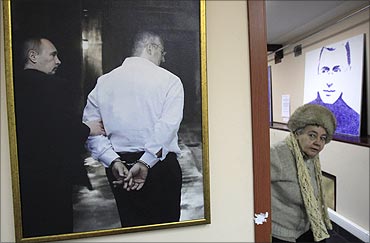 A woman visits an exhibition called 'To execute, not to pardon', dedicated to Khodorkovsky.
